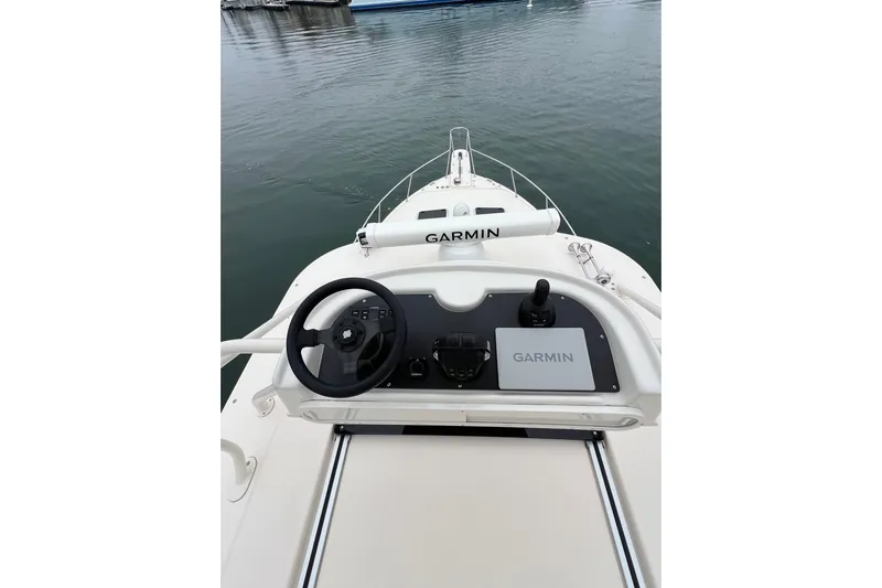 Be Chumming Yacht Photos Pics 2018 Grady-White Express 370 helm with Garmin navigation system on calm water.