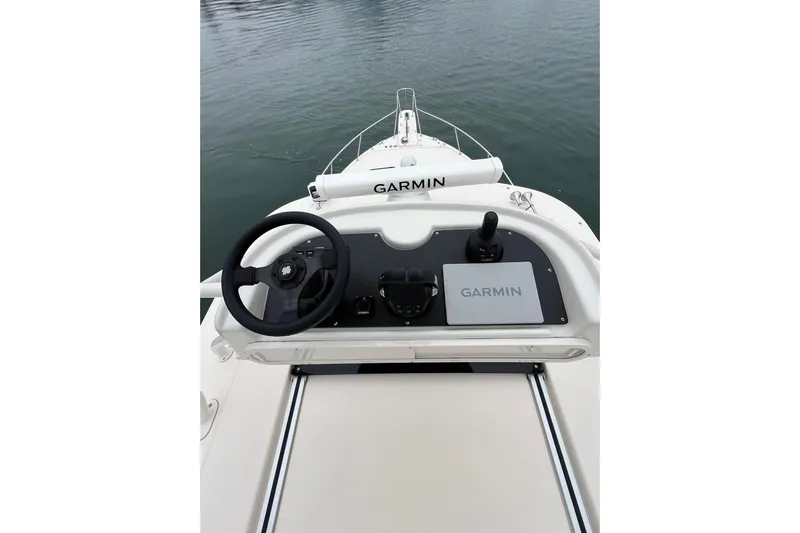 Be Chumming Yacht Photos Pics 2018 Grady-White Express 370 helm with Garmin navigation system on calm water.