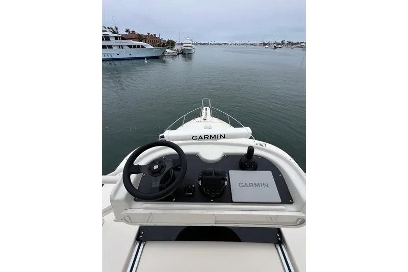 Be Chumming Yacht Photos Pics Helm of 2018 Grady-White Express 370 with Garmin navigation, overlooking marina.