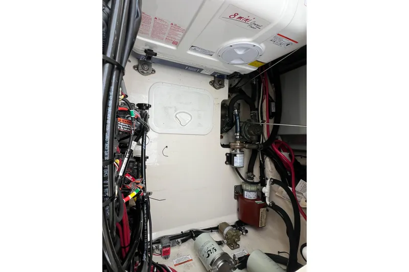 Be Chumming Yacht Photos Pics Engine compartment of 2018 Grady-White Express 370 boat, showcasing wiring and components.