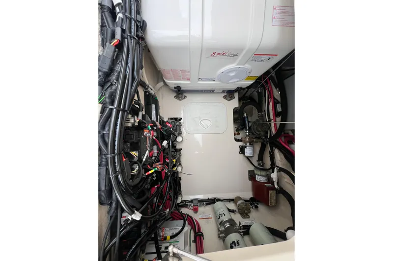Be Chumming Yacht Photos Pics Engine compartment of 2018 Grady-White Express 370 boat, showcasing wiring and components.