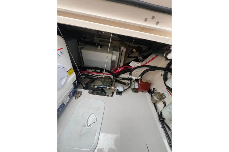 Be Chumming Yacht Photos Pics Engine compartment of 2018 Grady-White Express 370 boat, showcasing wiring and components.