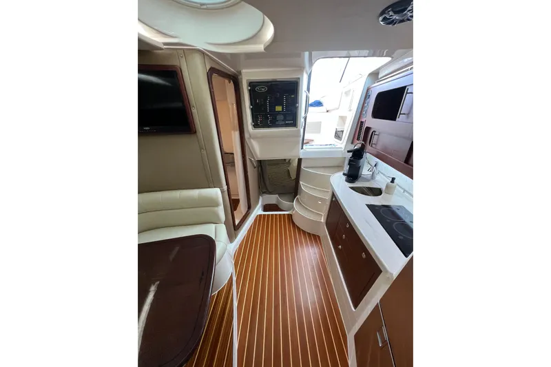 Be Chumming Yacht Photos Pics Interior of 2018 Grady-White Express 370 boat with modern kitchen and seating area.