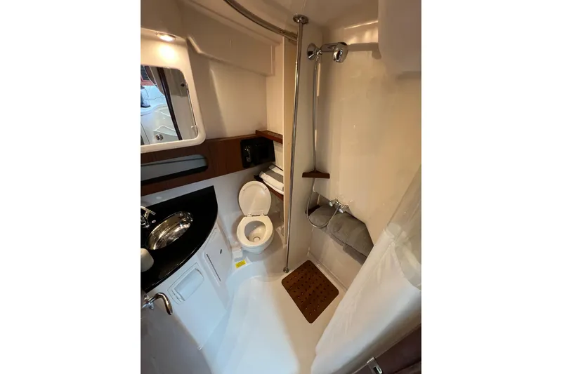 Be Chumming Yacht Photos Pics 2018 Grady-White Express 370 boat bathroom with shower, sink, and toilet.