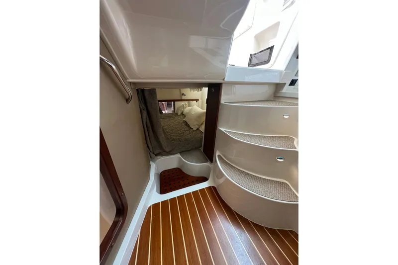 Be Chumming Yacht Photos Pics 2018 Grady-White Express 370 interior with wooden flooring and curved steps.