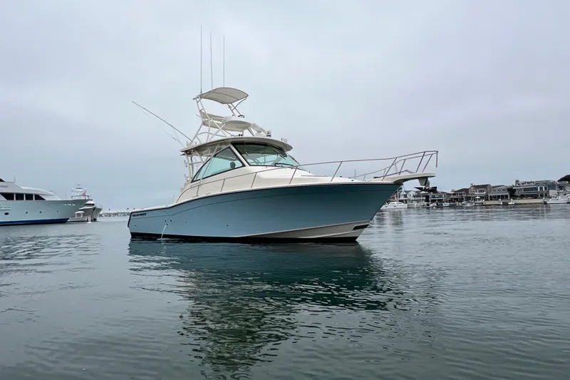 Be Chumming Yacht Photos Pics 2018 Grady-White Express 370 boat on calm water, overcast sky.