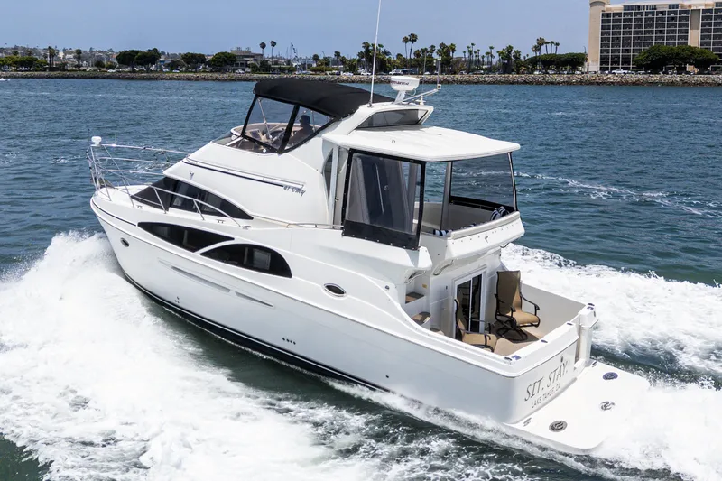  Yacht Photos Pics 2005 Carver 41 Cockpit Motor Yacht cruising on open water, rear view.