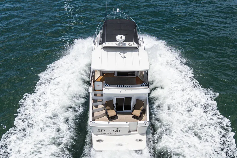  Yacht Photos Pics 2005 Carver 41 Cockpit Motor Yacht cruising on open water, aerial view.