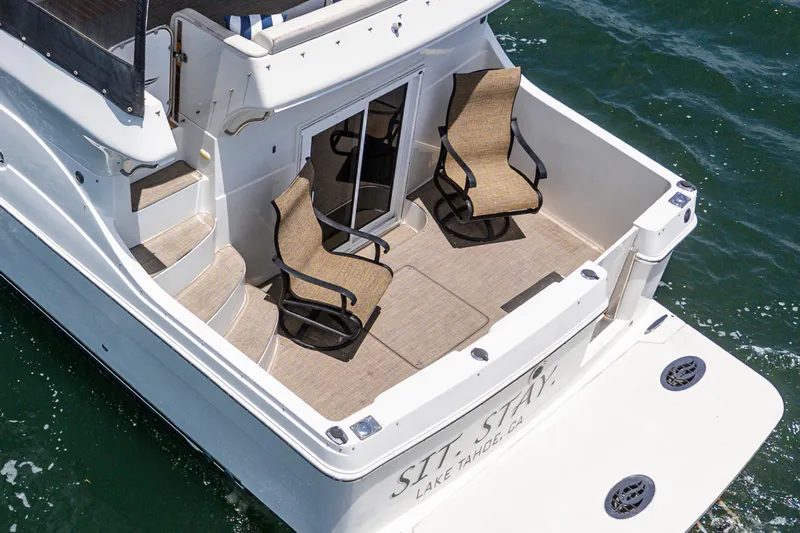  Yacht Photos Pics 2005 Carver 41 Cockpit Motor Yacht with seating area, on water.