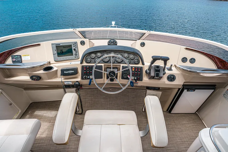  Yacht Photos Pics 2005 Carver 41 Cockpit Motor Yacht helm with steering wheel, controls, and navigation equipment.