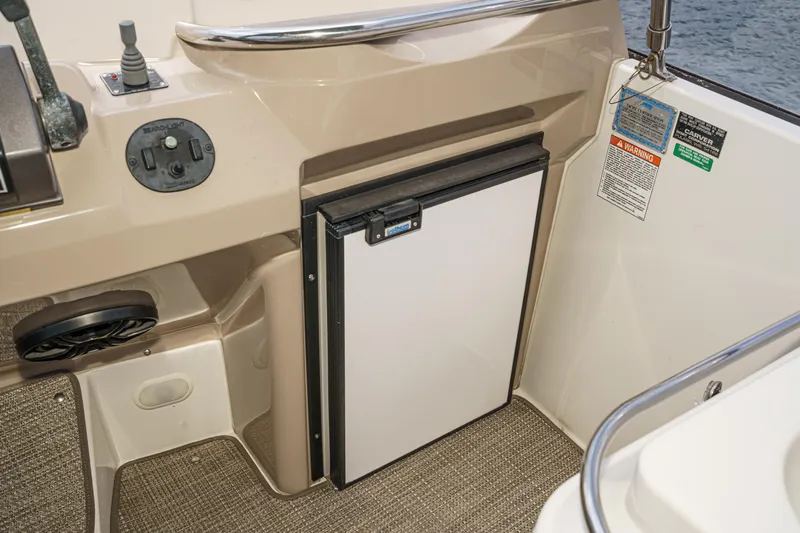  Yacht Photos Pics 2005 Carver 41 Cockpit Motor Yacht interior with mini fridge and control panel.