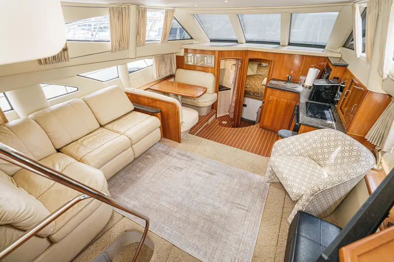  Yacht Photos Pics Luxurious interior of 2005 Carver 41 Cockpit Motor Yacht with plush seating and modern amenities.