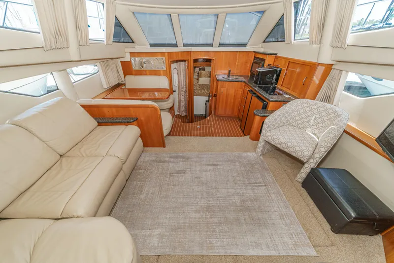  Yacht Photos Pics Luxurious interior of 2005 Carver 41 Cockpit Motor Yacht with leather seating and modern amenities.