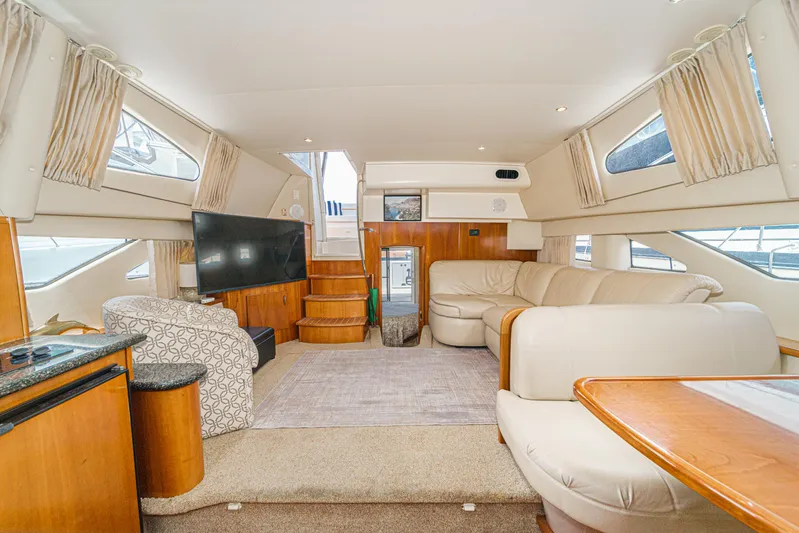  Yacht Photos Pics Luxurious interior of 2005 Carver 41 Cockpit Motor Yacht with plush seating and modern amenities.