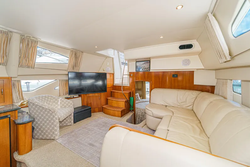  Yacht Photos Pics Luxurious interior of 2005 Carver 41 Cockpit Motor Yacht with plush seating and modern amenities.