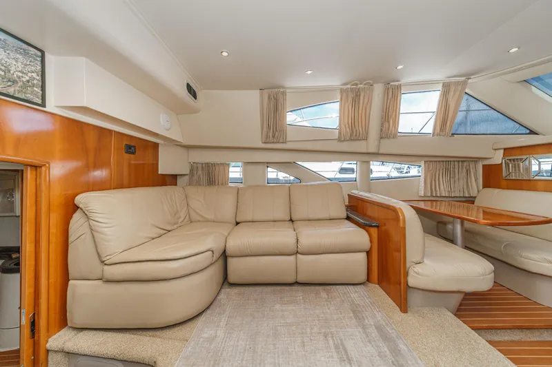  Yacht Photos Pics Luxurious interior of 2005 Carver 41 Cockpit Motor Yacht with beige leather seating.