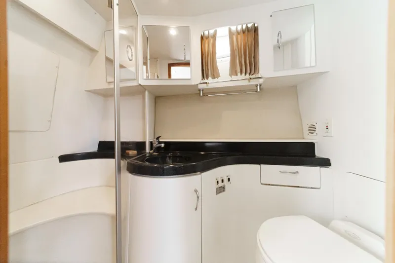 Yacht Photos Pics 2005 Carver 41 Cockpit Motor Yacht bathroom with modern fixtures and sleek design.