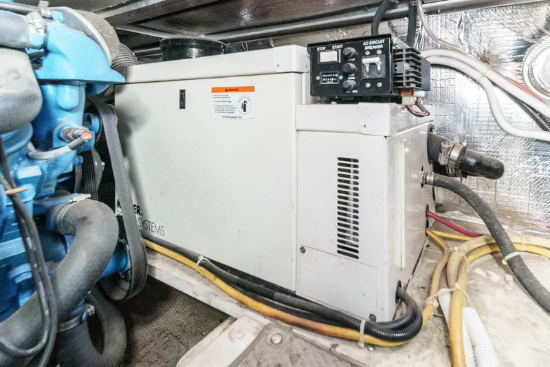  Yacht Photos Pics Engine room of 2005 Carver 41 Cockpit Motor Yacht with generator and wiring.