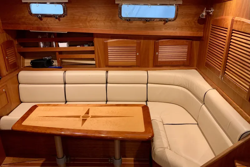 Lionheart Yacht Photos Pics Luxurious interior of 2006 Sabre 38 Hard Top Express with elegant wood and leather seating.