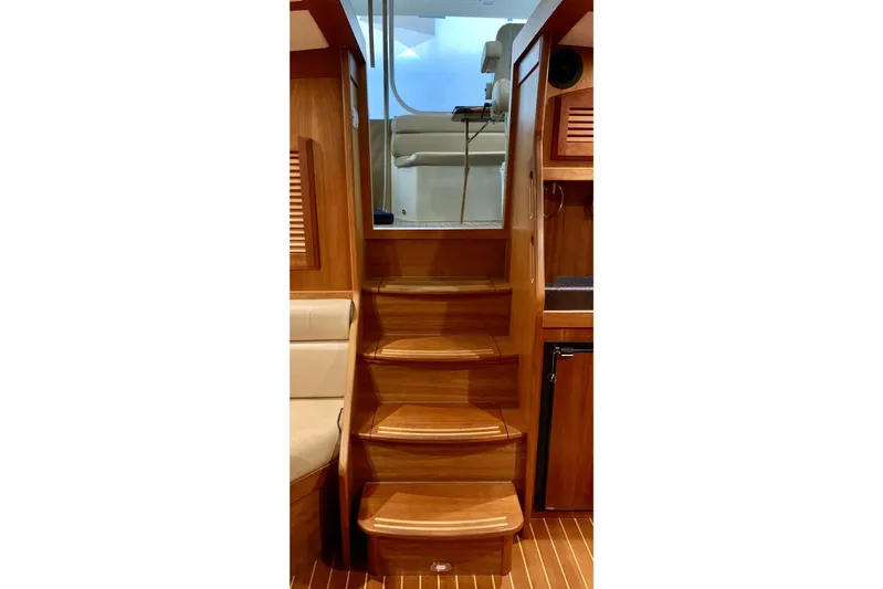 Lionheart Yacht Photos Pics Wooden interior stairs of 2006 Sabre 38 Hard Top Express yacht.