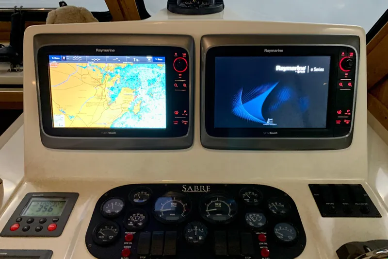Lionheart Yacht Photos Pics Helm of 2006 Sabre 38 Hard Top Express with Raymarine navigation displays.