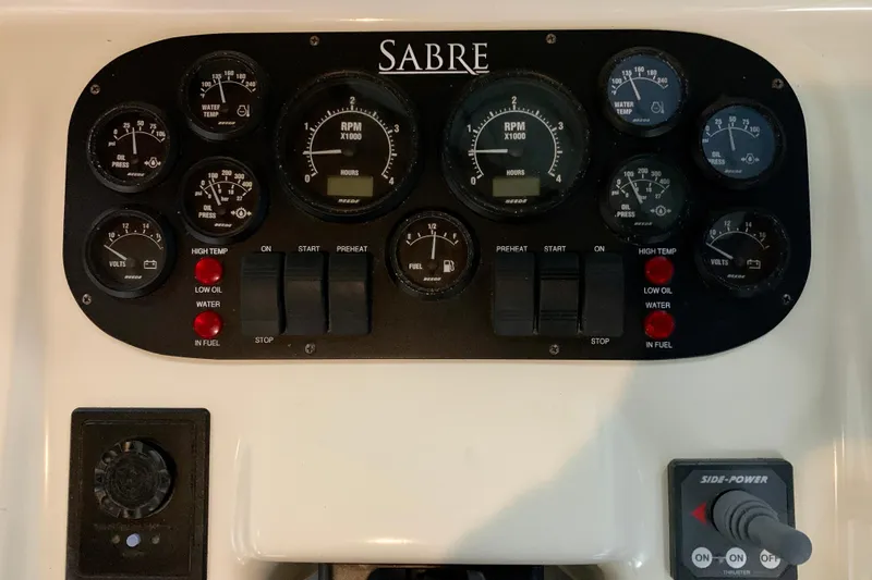Lionheart Yacht Photos Pics Control panel of 2006 Sabre 38 Hard Top Express with gauges and switches.