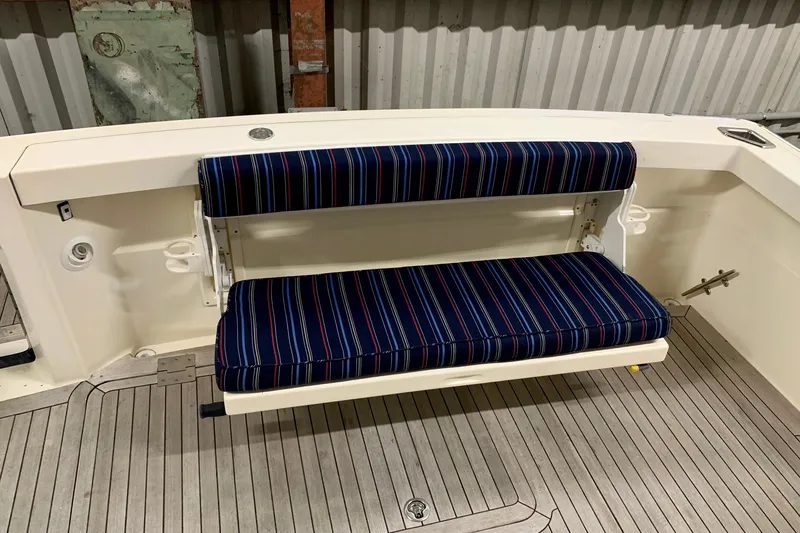 Lionheart Yacht Photos Pics 2006 Sabre 38 Hard Top Express boat with striped bench seating.