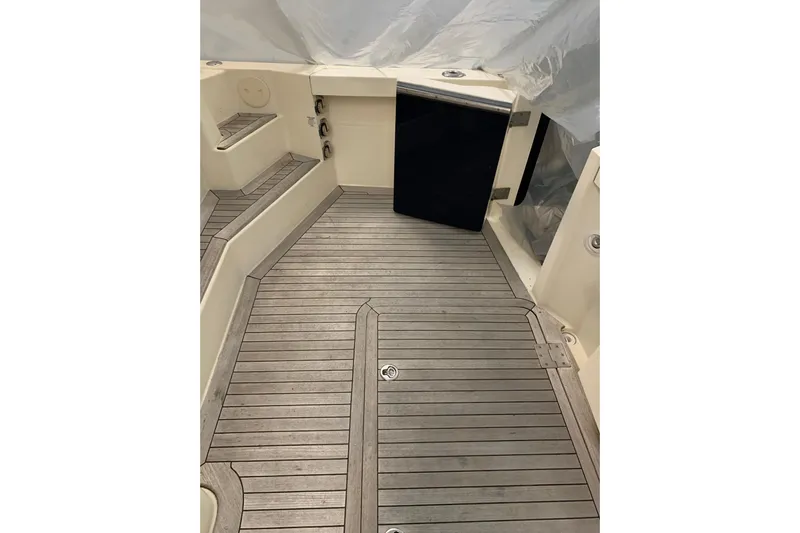 Lionheart Yacht Photos Pics 2006 Sabre 38 Hard Top Express boat deck with wooden flooring and seating.