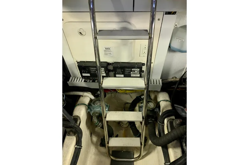 Lionheart Yacht Photos Pics Engine room of 2006 Sabre 38 Hard Top Express with ladder and equipment.