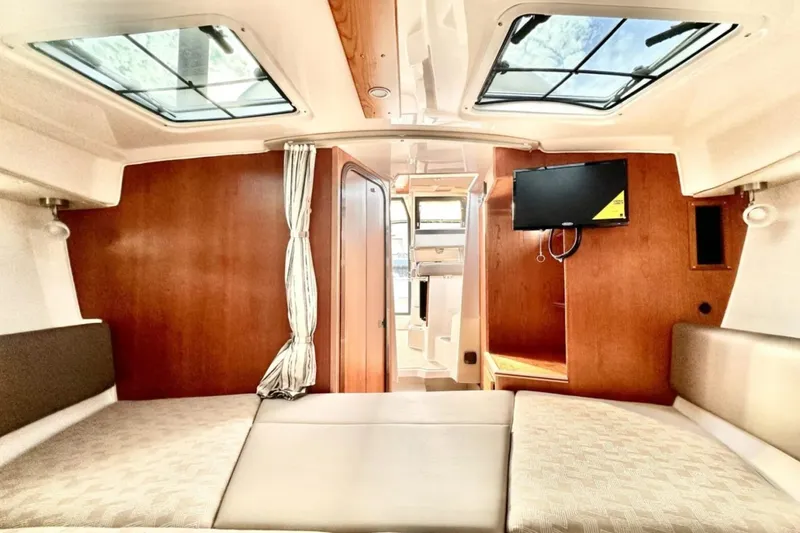  Yacht Photos Pics Interior of 2026 Cutwater C-288 Coupe, featuring cozy seating and a mounted TV.