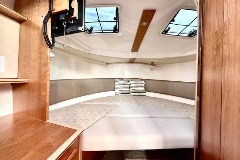  Yacht Photos Pics 2026 Cutwater C-288 Coupe interior cabin with cozy bed and skylights.