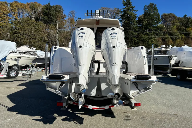  Yacht Photos Pics 2026 Cutwater C-288 Coupe with dual 250 V6 outboard engines, parked outdoors.
