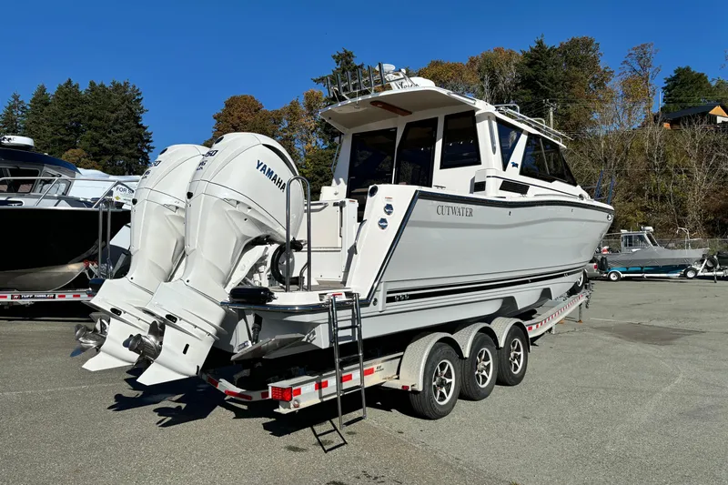  Yacht Photos Pics 2026 Cutwater C-288 Coupe boat with dual Yamaha engines on a trailer.