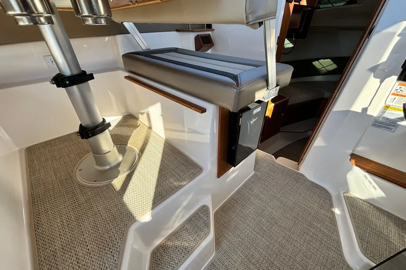  Yacht Photos Pics Interior of 2026 Cutwater C-288 Coupe, featuring seating and carpeted flooring.