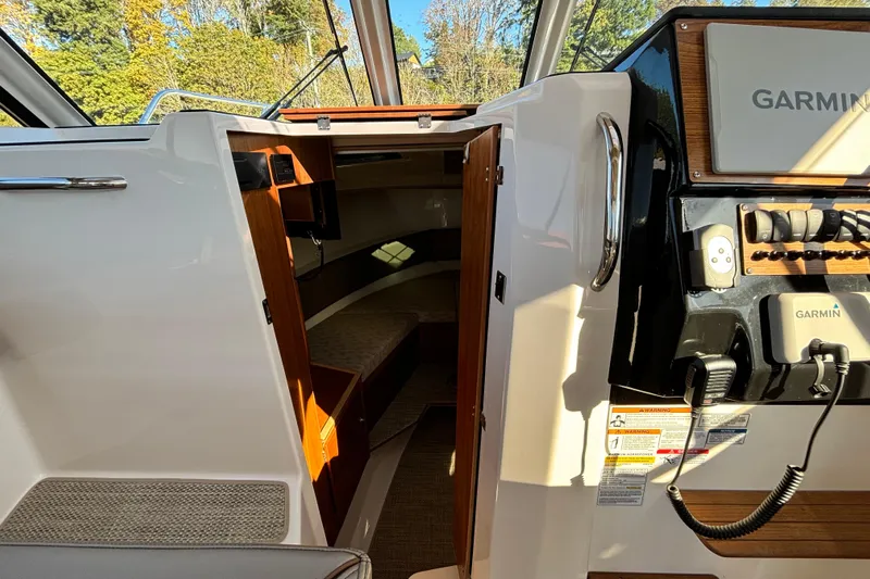  Yacht Photos Pics 2026 Cutwater C-288 Coupe interior with Garmin navigation system and cabin entry.