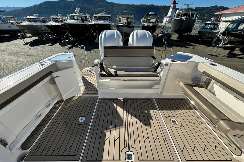  Yacht Photos Pics 2026 Cutwater C-288 Coupe boat interior with seating and deck, surrounded by other boats.