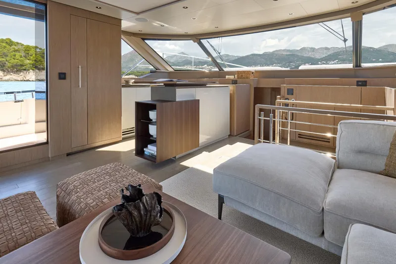 Yacht Photos Pics Luxurious interior of 2026 Prestige M7 yacht with modern furnishings and scenic ocean view.