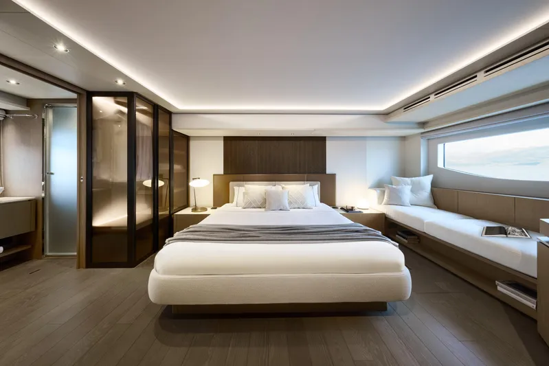  Yacht Photos Pics Luxurious Prestige M7 2026 yacht bedroom with modern design, large bed, and elegant lighting.
