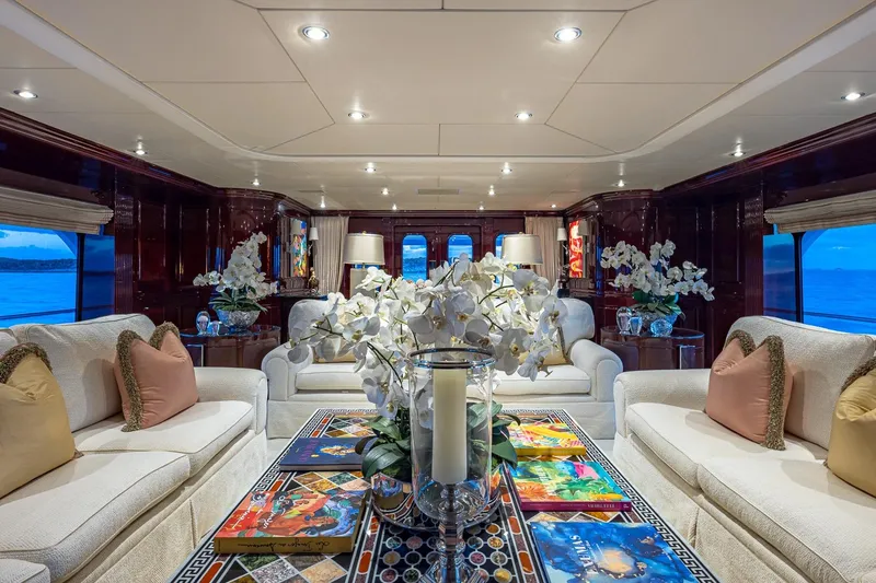 Lady Joy Yacht Photos Pics Luxurious interior of 2007 Christensen Tri-Deck yacht with elegant seating and floral decor.