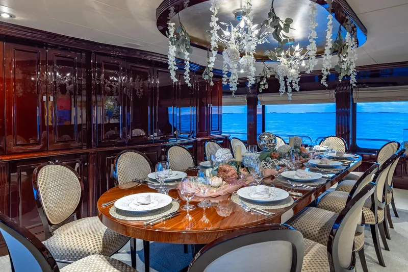 Lady Joy Yacht Photos Pics Luxurious dining room on 2007 Christensen Tri-Deck yacht with elegant decor and ocean view.