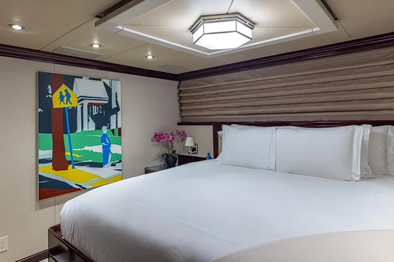 Lady Joy Yacht Photos Pics Luxurious bedroom on 2007 Christensen Tri-Deck yacht with modern art and elegant decor.