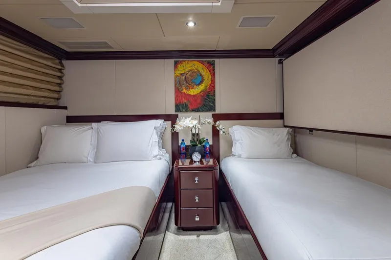 Lady Joy Yacht Photos Pics Luxurious twin bedroom on 2007 Christensen Tri-Deck yacht with elegant decor and artwork.