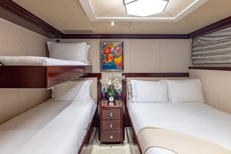 Lady Joy Yacht Photos Pics Luxurious 2007 Christensen Tri-Deck yacht cabin with elegant bedding and vibrant artwork.