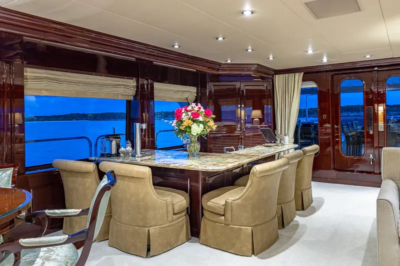 Lady Joy Yacht Photos Pics Luxurious interior of 2007 Christensen Tri-Deck yacht with elegant dining area and ocean view.