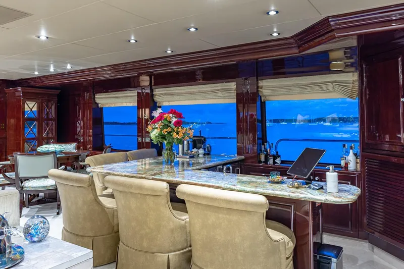 Lady Joy Yacht Photos Pics Luxurious interior of 2007 Christensen Tri-Deck yacht with elegant bar and ocean view.