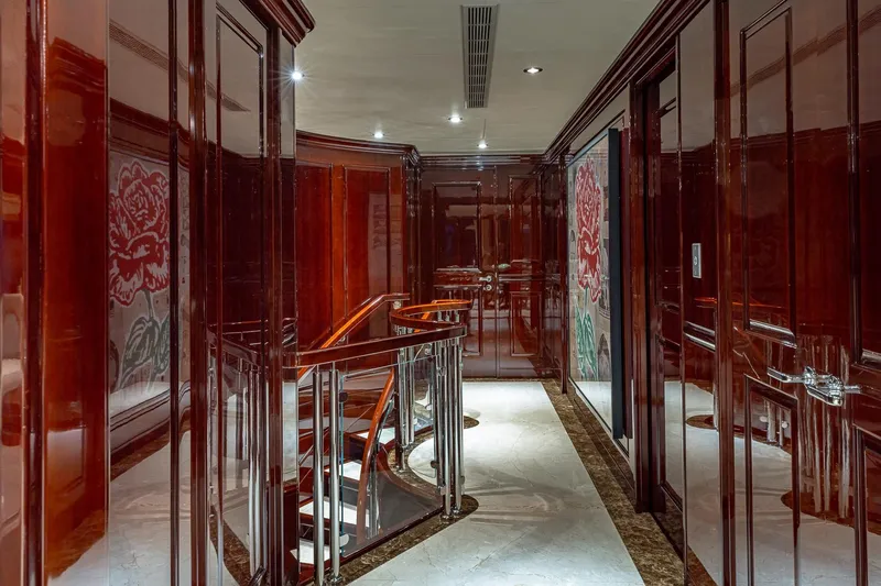 Lady Joy Yacht Photos Pics Luxurious interior of 2007 Christensen Tri-Deck yacht with polished wood and elegant staircase.