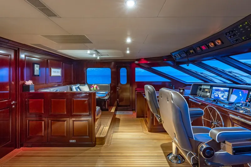 Lady Joy Yacht Photos Pics Luxurious 2007 Christensen Tri-Deck yacht interior with elegant wood paneling and advanced navigation equipment.