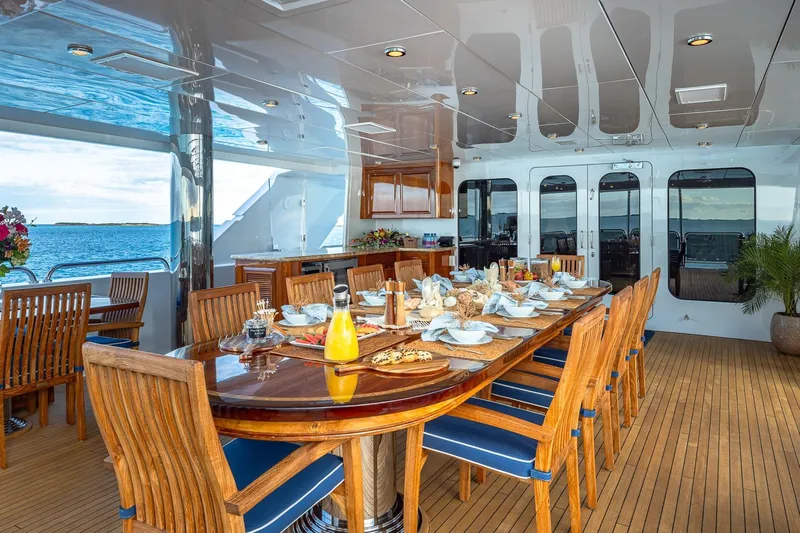 Lady Joy Yacht Photos Pics Luxurious dining area on 2007 Christensen Tri-Deck yacht with ocean view.
