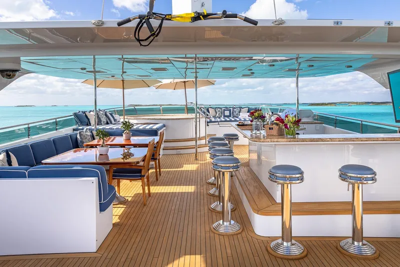 Lady Joy Yacht Photos Pics Luxurious 2007 Christensen Tri-Deck yacht with elegant outdoor seating and bar area.