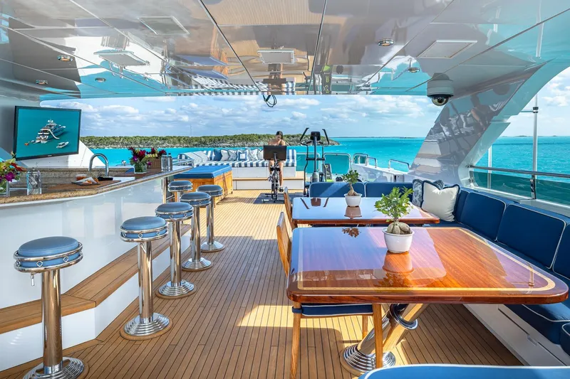 Lady Joy Yacht Photos Pics Luxurious 2007 Christensen Tri-Deck yacht with elegant outdoor seating and bar area.